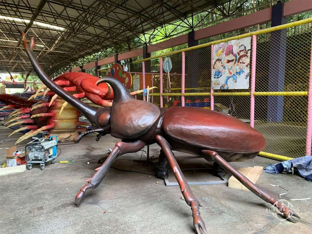 Animatronic beetle insect model displayed in AuroraGong factory warehouse
