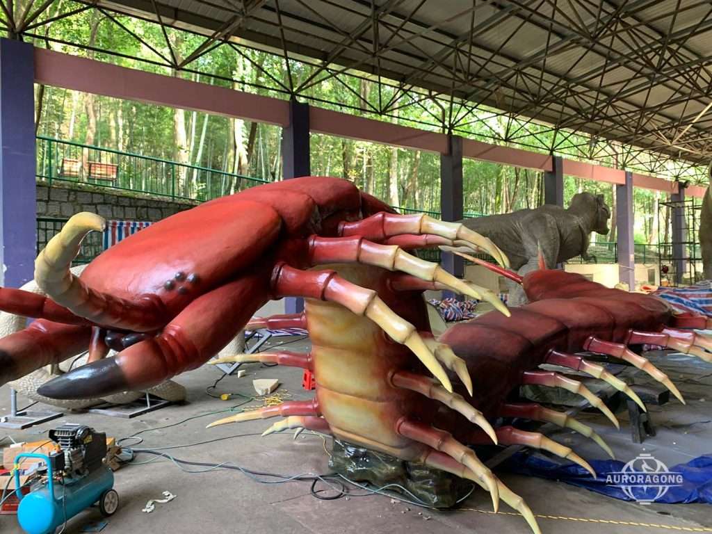 AuroraGong animatronic centipede creature model in factory production area
