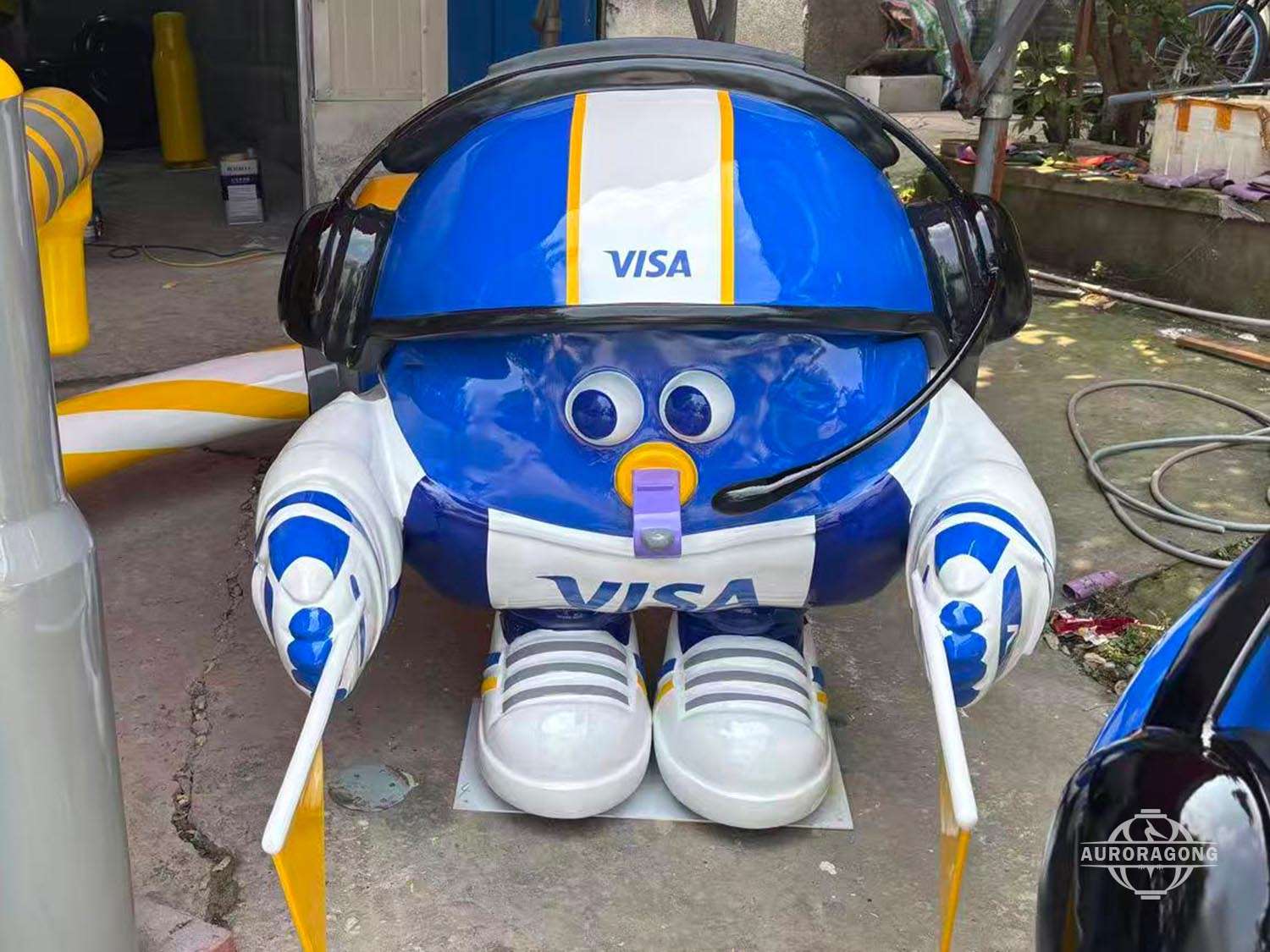 Front view of blue VISA mascot fiberglass sculpture display