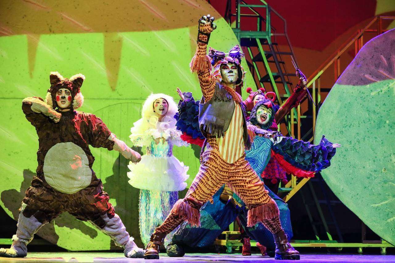 Stage performance featuring realistic orangutan costume for adults