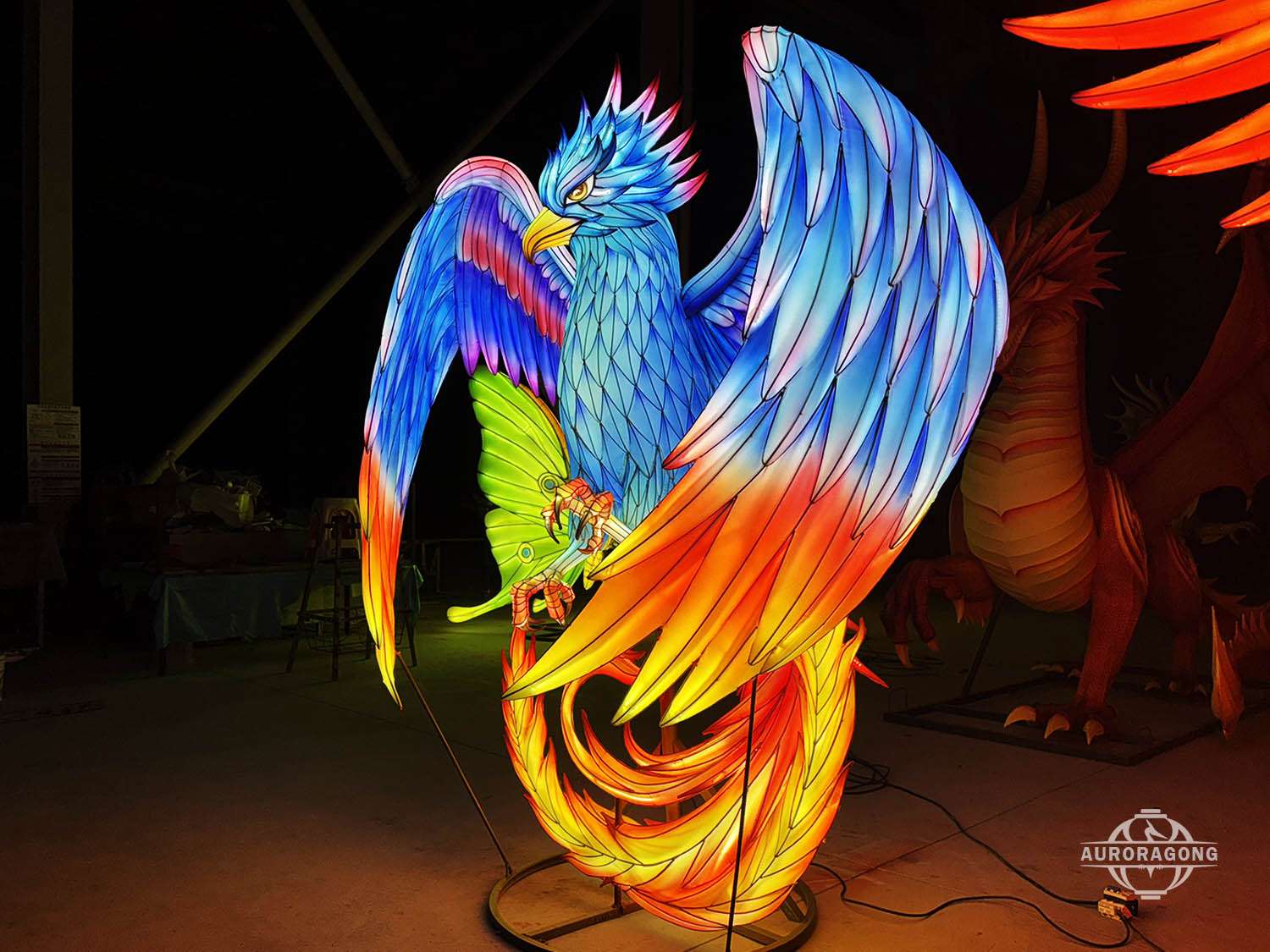large blue phoenix lantern illuminated at night