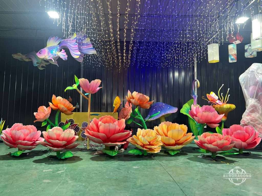 Custom illuminated large peony lanterns with butterflies, dragonflies, and hanging star lights in display