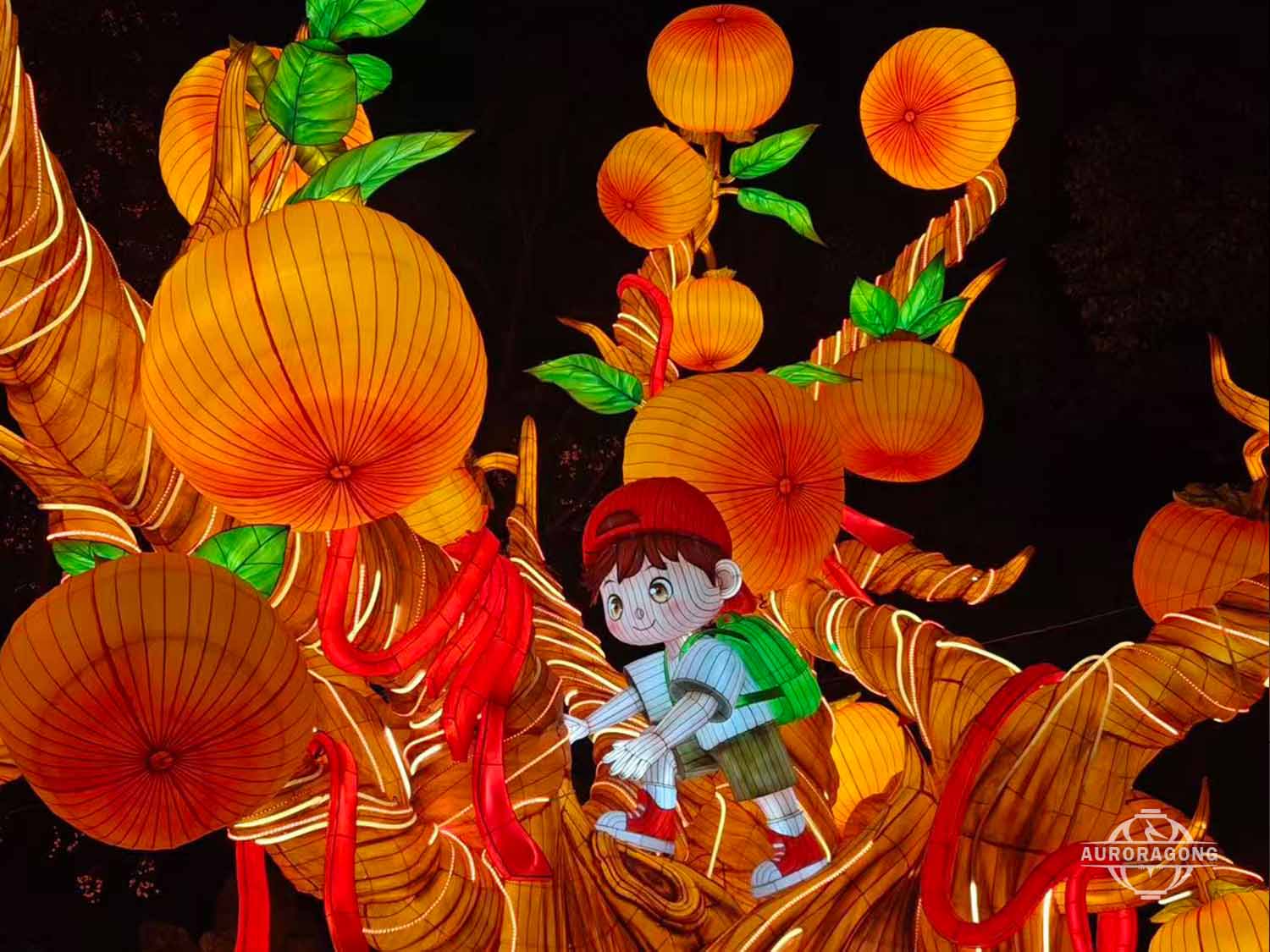 Custom illuminated persimmon tree lantern with boy character climbing among orange fruits and red chili strings at night
