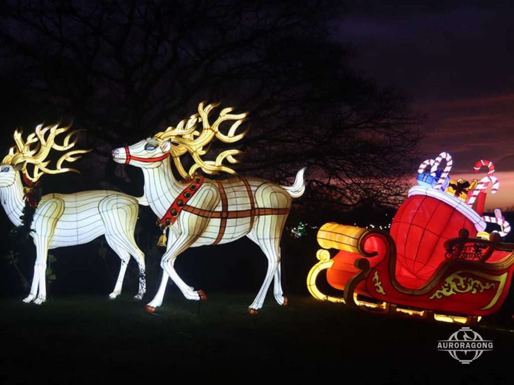 Custom illuminated Christmas scene with two reindeer pulling Santa sleigh lantern at dusk