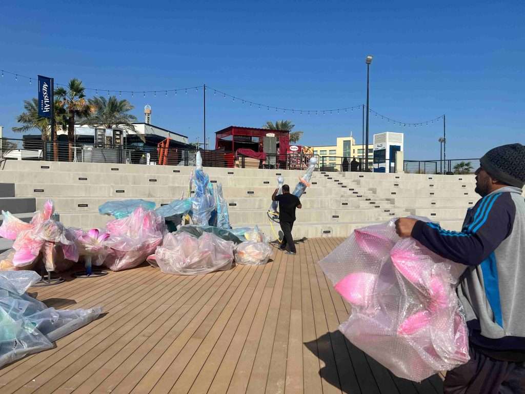 Engineering team and local workers assembling light festival structures