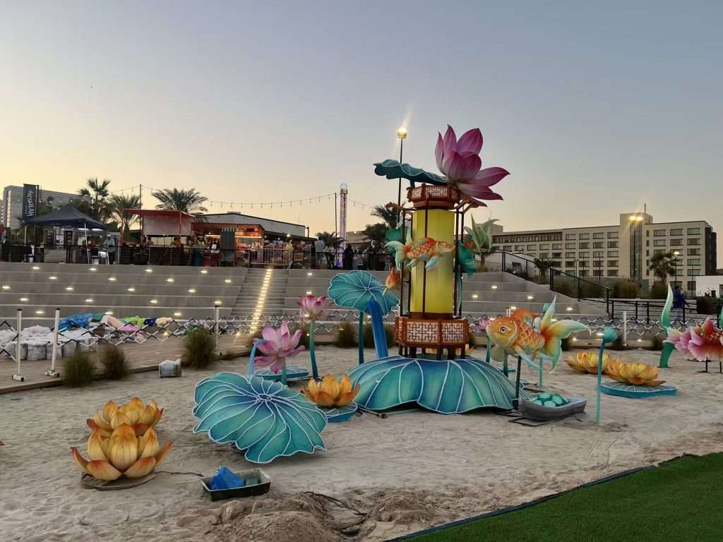 Large rotating lotus lantern installation at the Lighting Festival in Kuwait