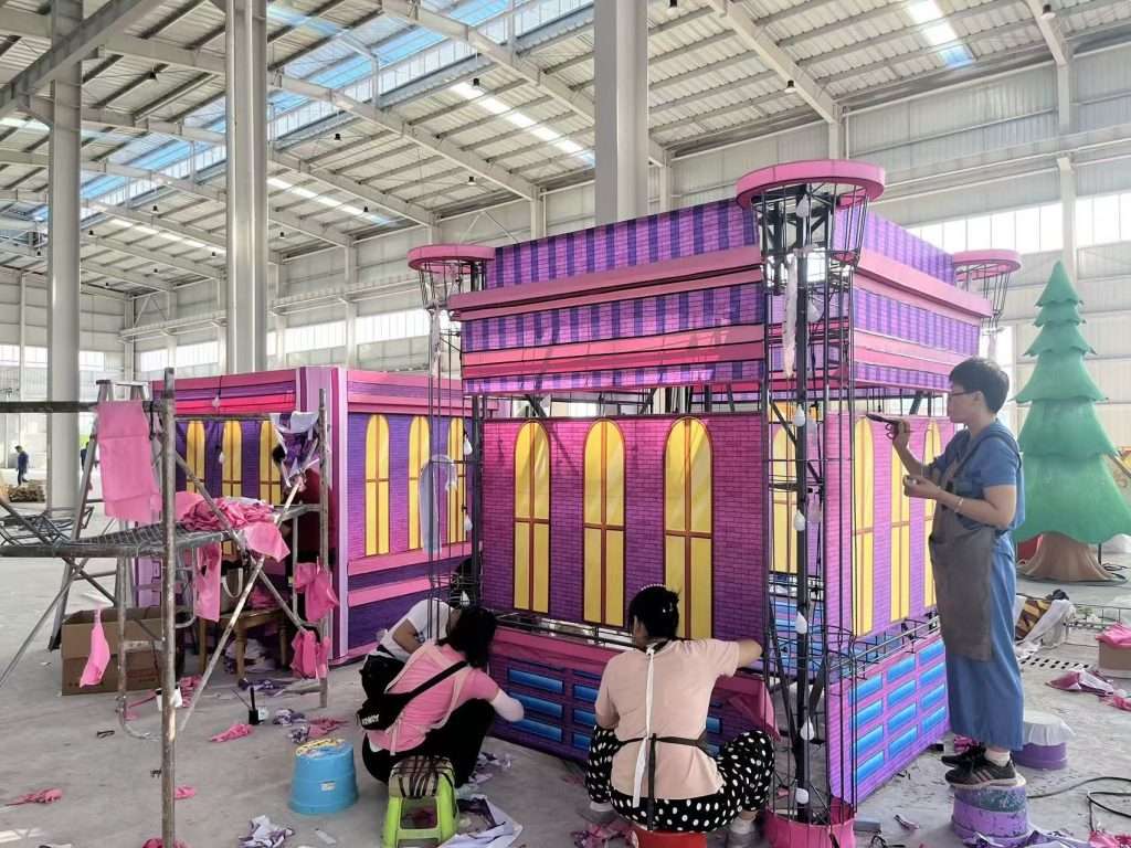 Production of large-scale decorative lighting structures in factory workshop