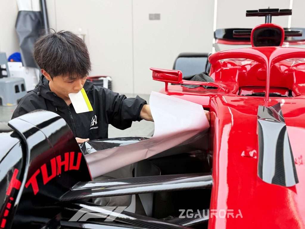 Zigong artisans handcrafting a full-scale F1 racing model