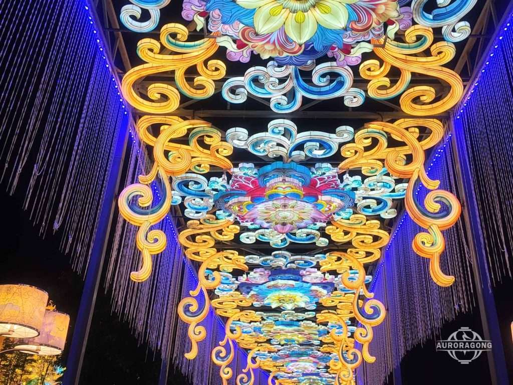 Ornate traditional Chinese pattern lanterns in gold and blue creating an immersive commercial street corridor at night