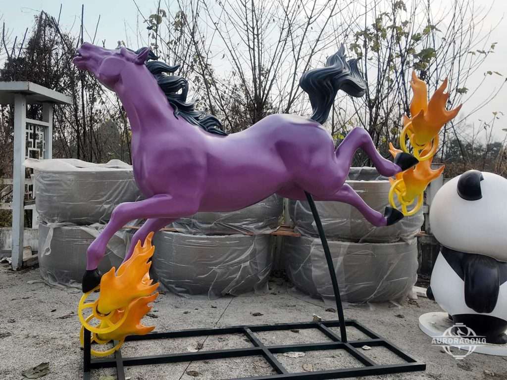 Colorful fiberglass horse sculpture with purple running horse design