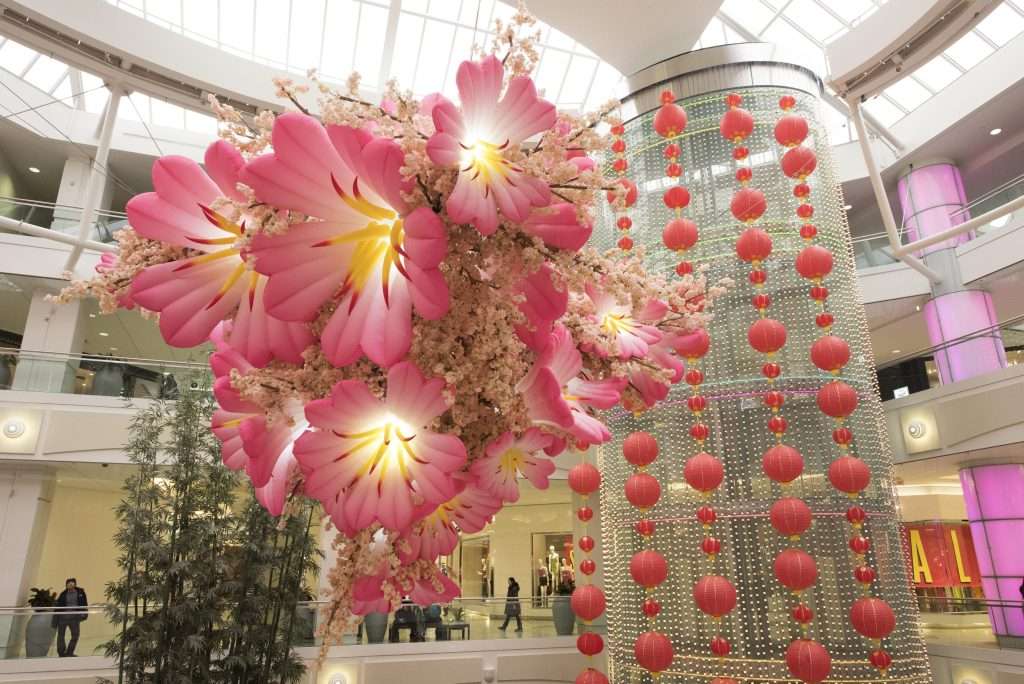 Large hanging lantern installation creating a visual landmark in a mall atrium