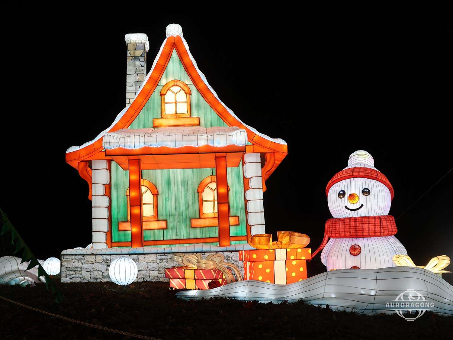 Christmas glowing snow house and snowman lantern scene set for holiday festival display