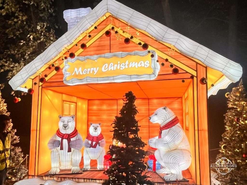 Christmas polar bear family lantern scene with Merry Christmas cottage and holiday tree